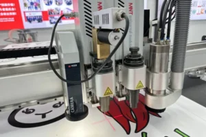 CCD camera, oscillating knife, drag blade and milling spindle on the MNT T7 cutting printed graphics