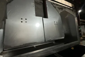 Press-formed sheet metal machine parts made in-house before painting