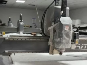 MNT T5 precision CNC router machining a solid PTFE block on a customer shop floor