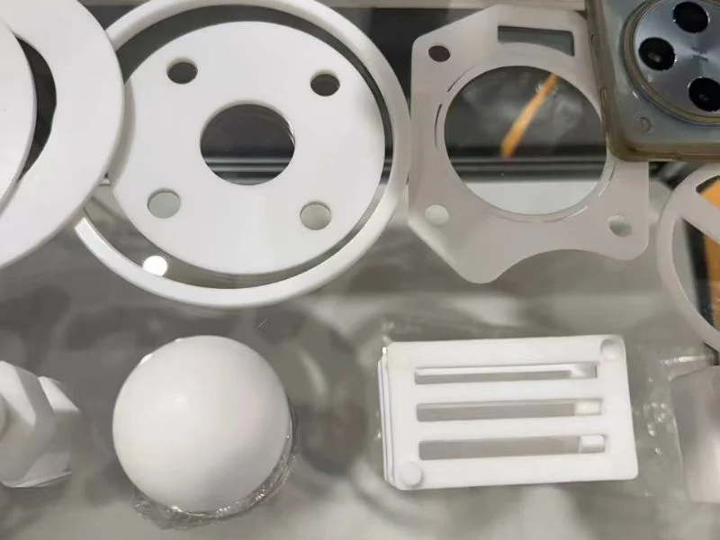 PTFE parts machined on CNC router with slots, holes, pockets and 3D features vs waterjet outline-only