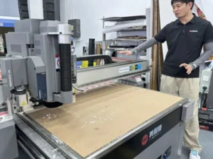 Operators sorting cut composite plies and stacking them strictly following the layup sequence to form complete pre-organized ply kits for lamination technicians