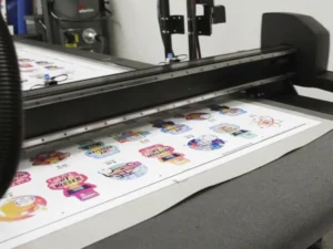 Flatbed cutter with finished cut packaging samples
