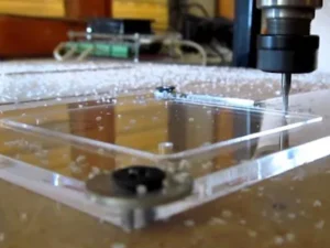 CNC router milling an acrylic sheet with an O-flute bit