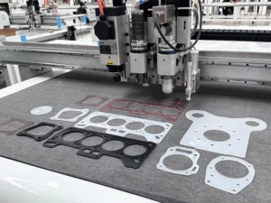 CNC router cutting PTFE plate with clean, fuzz-free edge using sharp high-rake tool