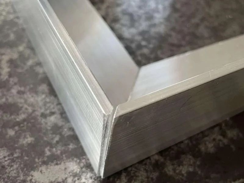 Precision CNC cut miter joints and weld‑prep notches for sheet assembly and fabrication work