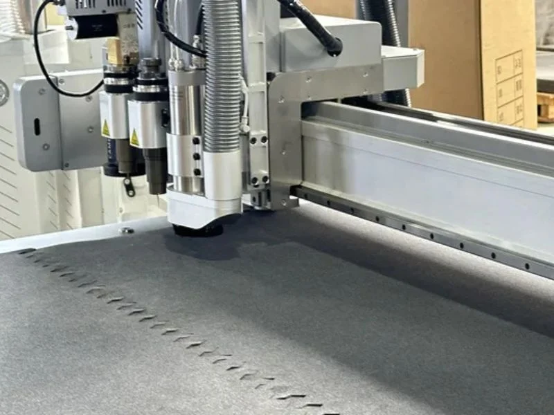 Vacuum workholding system securing mixed materials and varying thickness on flatbed cutter