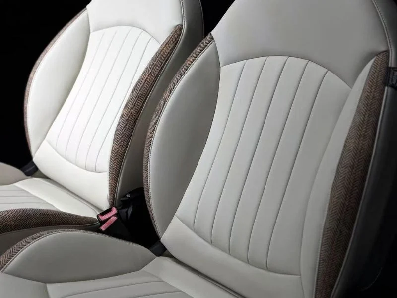 Perforated leather automotive seat cover cut in register on the MNT C-series