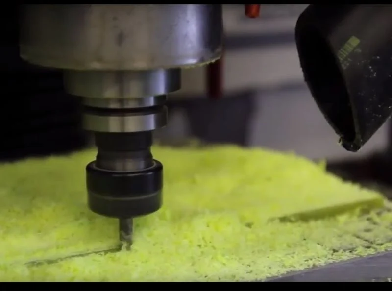 Worn carbide router bit beside a diamond-coated cutter after machining glass-epoxy laminate