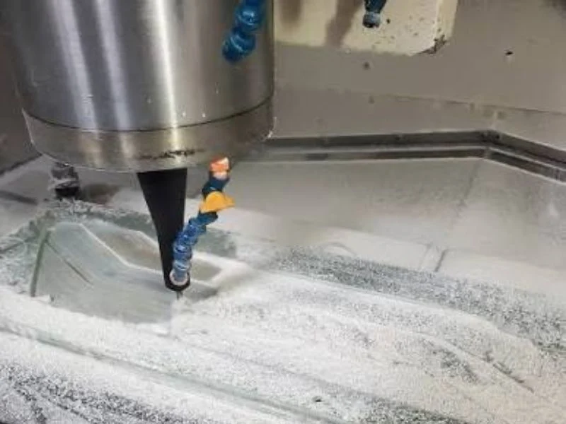 Dust extraction hood and filtration unit on an MNT CNC router cutting laminate