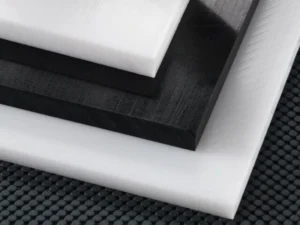 Natural white Delrin acetal homopolymer rod and sheet stock before machining