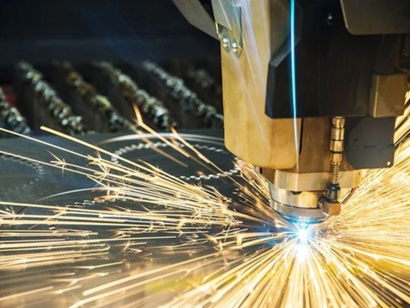 Fiber laser cutting head in operation
