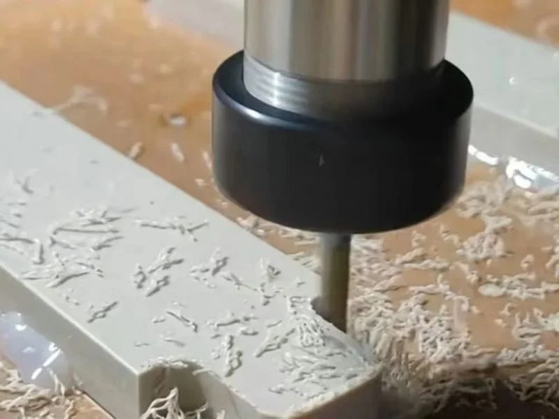 Program proof cut in cheap polymer beside the finished PEEK part