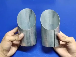 Round steel tube laser cut with holes in one operation