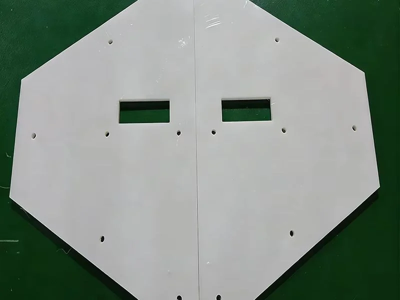 Machined UHMW hopper liner panel with bolt pattern for chute installation