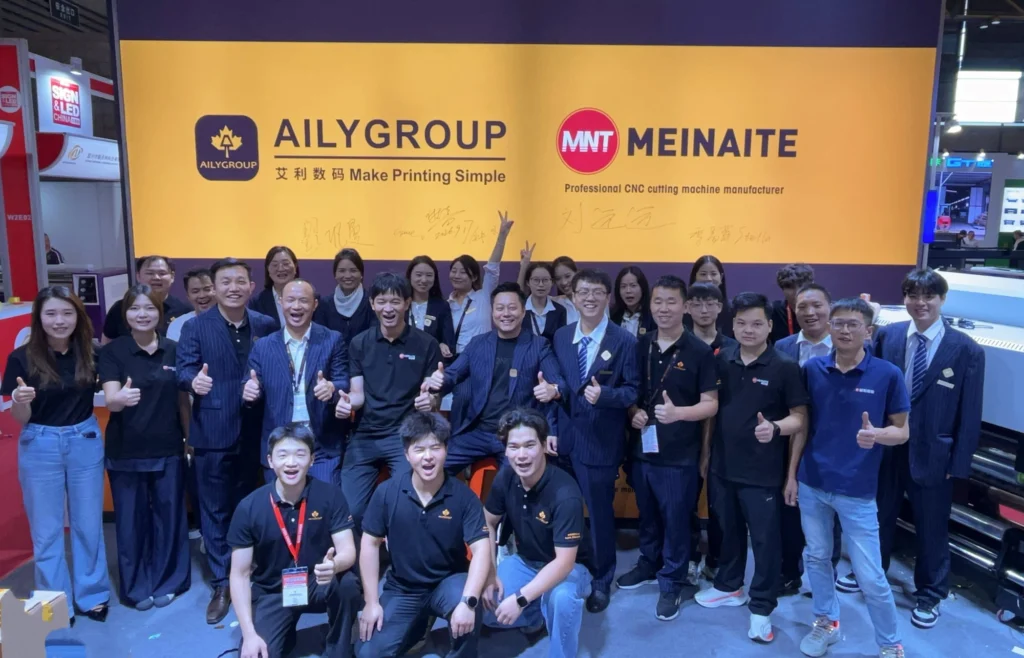 The MNT MEINAITE and AILYGROUP team on the shared stand at SIGN CHINA 2026 in Shanghai